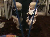 Adorable Twins Giggling Uncontrollably in Jolly Jumpers - Aww